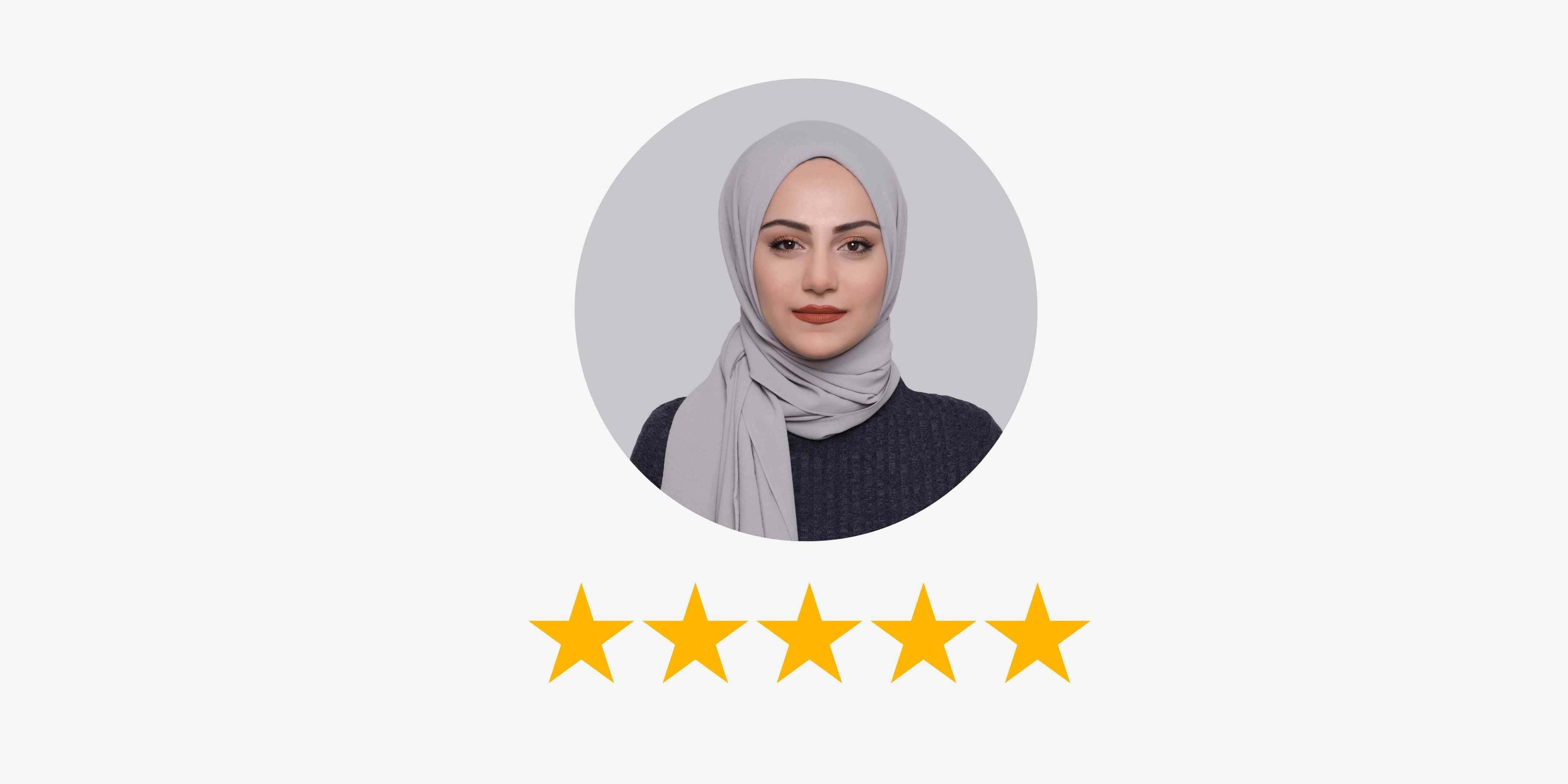 Woman in elegant abaya with gold detailing and matching hijab